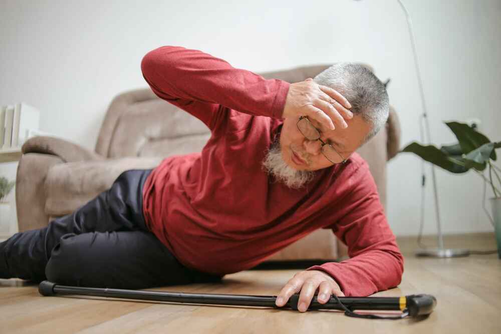 Older man falling on floor