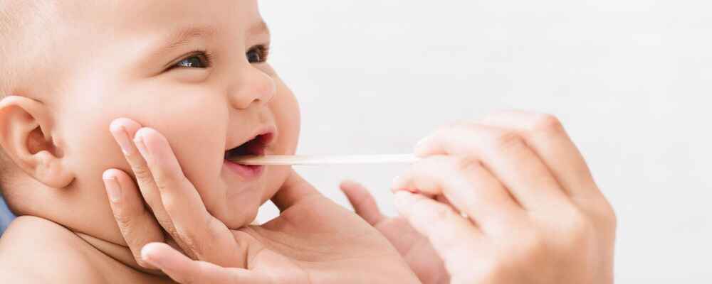 ENT doctor checking baby's mouth